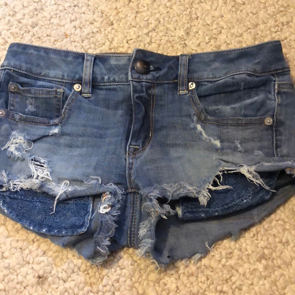 Jean shorts with rips and pocket detailing.
